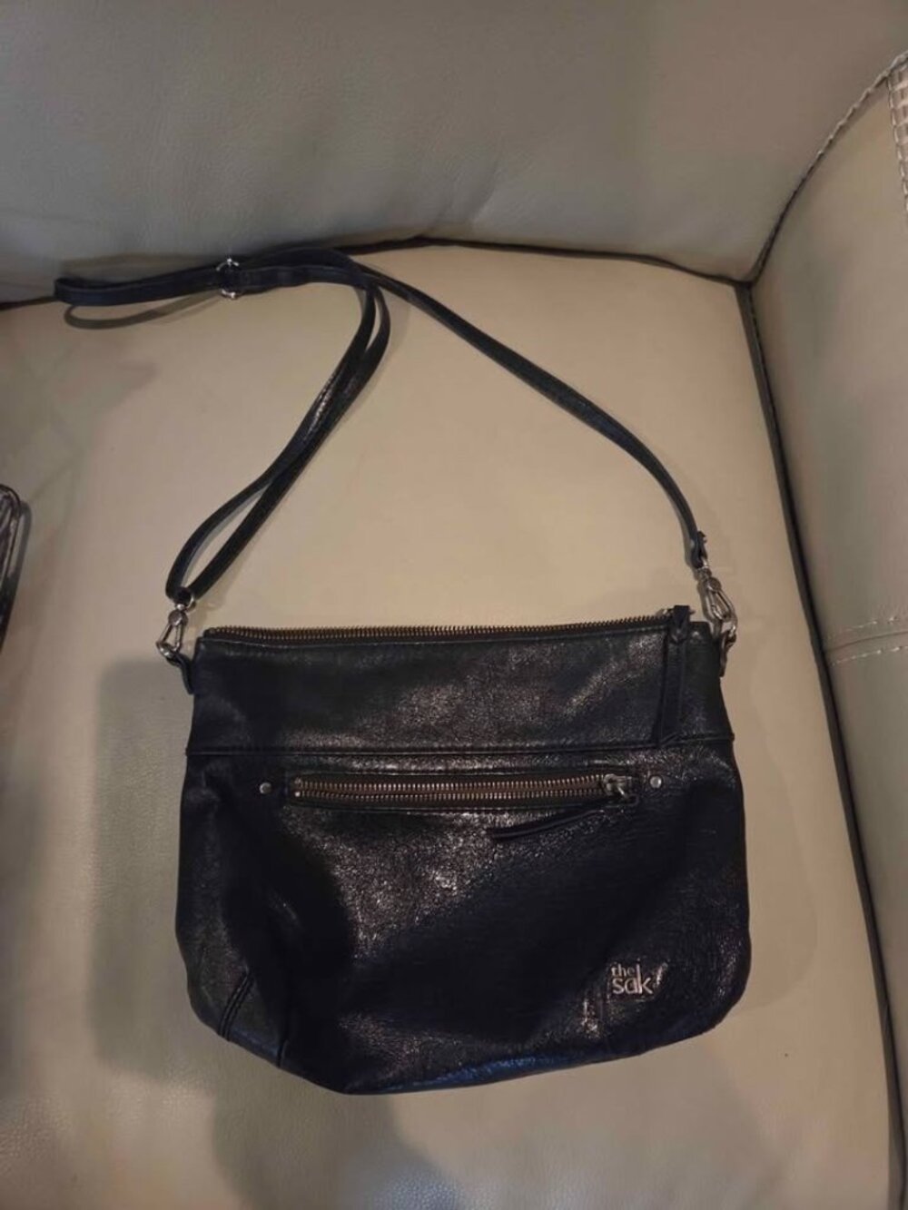 The Sak brand crossbody bag